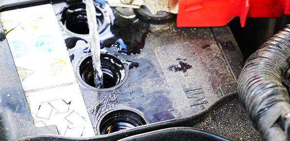 Adding-Water-to-Car-Battery Adding-Water-to-Car-Battery